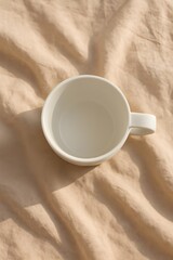 cup of coffee on sand