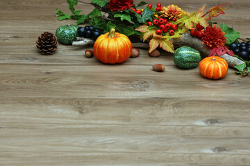 Autumn background with autumn leaves and pumpkins.
