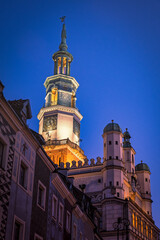 Town Hall tower illuminated at dusk over Poznan Market Square in Poland