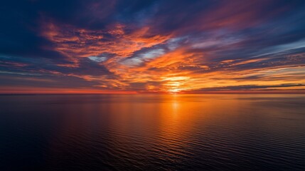 vibrant sunset over calm ocean water with colorful sky and peaceful reflection