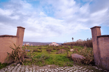 Scenic View of Rustic Gate Opening Into Lush Green Countryside Landscape