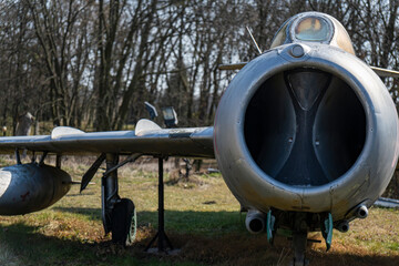 Old Polish military aircraft on display in an outdoor setting near historic region