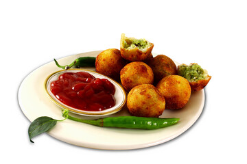 traditional Indian Gujarati food snack vegetable stuffed fried balls patties also known in India as cutlet, kachori, kachodi, samosa, pakoda with tomato sauce, cutout in transparent background, png
