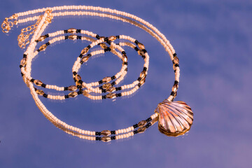 Beautiful handmade necklace and braclet on background