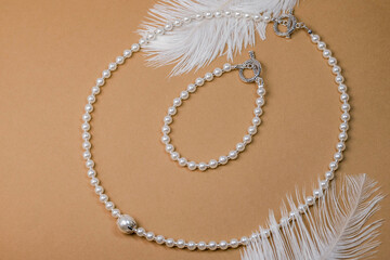Beautiful handmade necklace and braclet on background