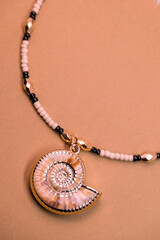 Beautiful handmade necklace and braclet on background