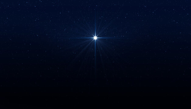 Glowing star in the night sky. Symbol of Christmas and New Year.