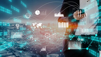 A business professional engages with data trends on a smartphone amidst digital graphics and a...