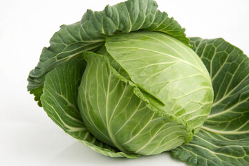 Fototapeta premium Close-up of a single, raw green cabbage, highlighting its leafy texture and fresh appearance.