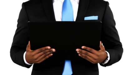 Business professional holding a tablet in a formal suit setting