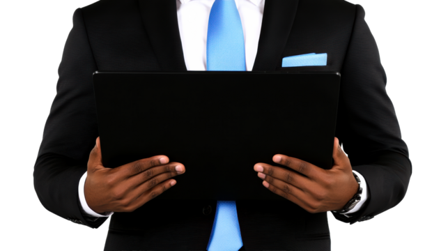 Business professional holding a tablet in a formal suit setting