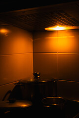 Evening Kitchen Warmth with Soft Light Above Stove