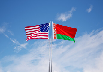flags of  belarus and United States of America over blue sky background.
