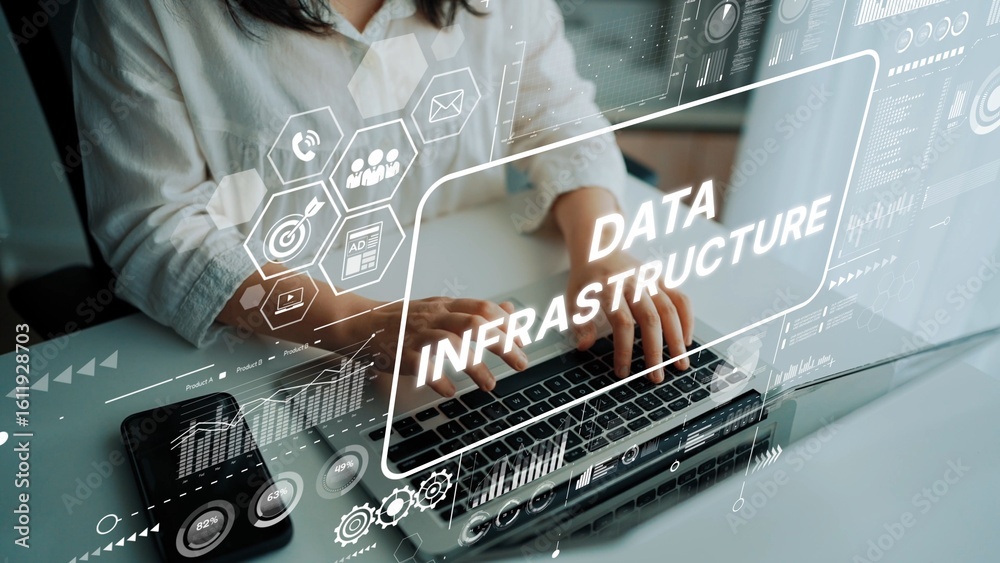 Poster elegant workspace featuring hands typing on a laptop with overlay text illustrating modern data infr