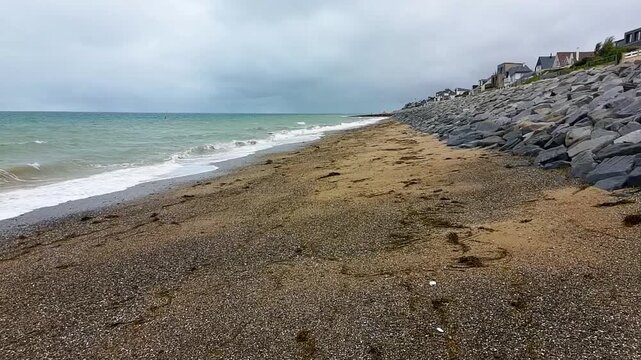Aerial Drone Shot Moving Forward Between Sandy Beach and Ocean - Cloudy Sky 