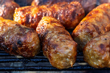 Pork chops, steak, sausages on barbecue grill