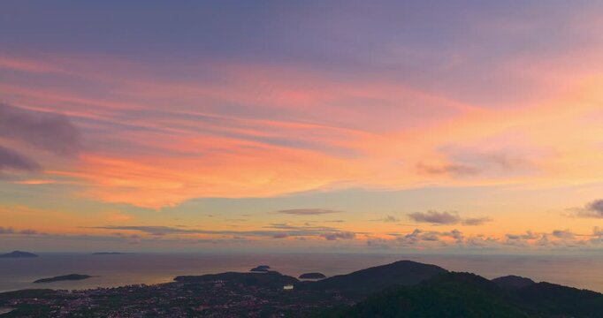 aerial view stunning sunrise above archipelago Phuket. beautiful moving cloud in vivid sky at sunrise. 4k stock footage video in travel concept. amazing colorful clouds over the horizon