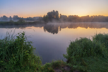 summer majestic sunrise over the lake