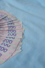 money cash close up on blue background