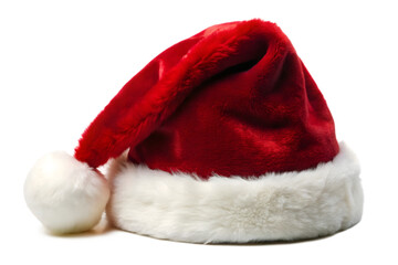 A classic red santa hat made of soft velvet with a plush white fur trim and pompom, presented isolated on a transparent background