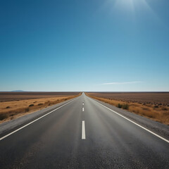 Naklejka premium The text describes an empty road that extends to the horizon in a dry field.