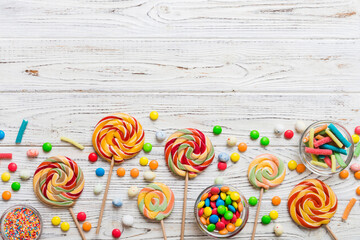 Tasty appetizing Party Accessories Happy Birthday Sweet. Different types of candies on colored...