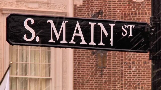 Main Street Sign with Light Snowfall in Downtown Greenville SC