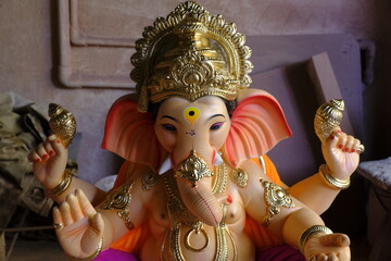 Newly made idols of the God known as Ganesha or Ganapati for sale at a shop on the eve of Ganesh festival in Pune, India.