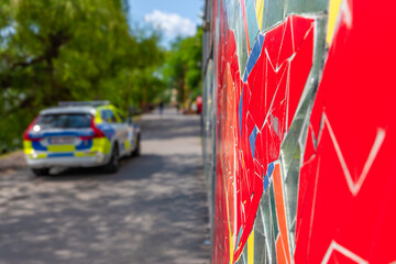Colorful Mural with blurred Police Car in Stockholm