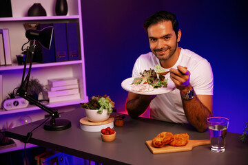 Healthy influencer in host channel tasting chicken meat ingredient health on diet life in mixed salad for easy cooking product by self with tasty food on social media live on meal time. Surmise.