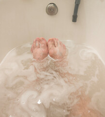 Man in a bath. Male client in an aroma bath at a spa