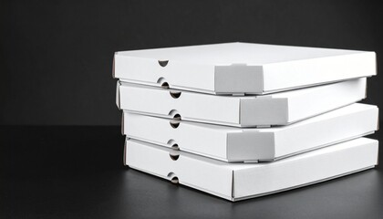 Stack of four closed white pizza boxes on black background — minimalist composition emphasizing contrast, geometry, and utilitarian packaging design.