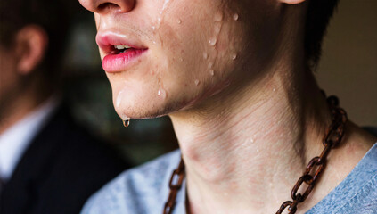 Close-up of Sweating Man with Rusty Chain