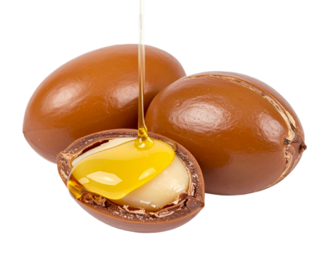 Luxurious argan oil dripping onto argan nuts, showcasing natural Moroccan beauty and skincare benefits