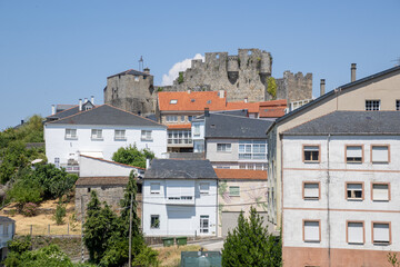 Picturesque Castro Caldelas in Ribeira Sacra, Ourense, Galicia, Spain, with whitewashed houses and medieval castle, listed among the most beautiful villages in Spain.