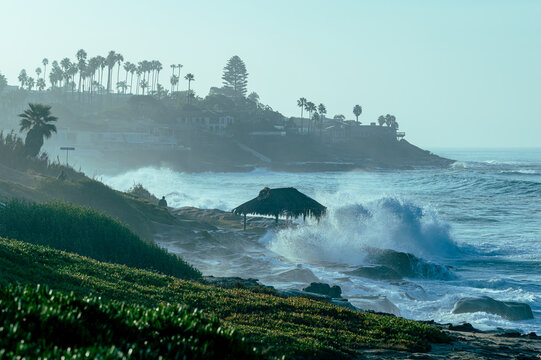Large king tide waves crashing on shore in La Jolla San Diego California