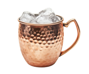Photo of a hammered copper moscow mule mug filled with ice and a refreshing beverage, isolated on a transparent background