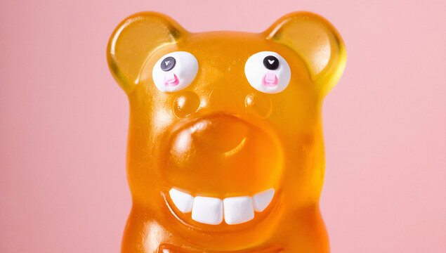 Orange Gummy Bear Candy with Added Eyes and Teeth - Powered by Adobe