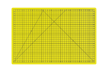 A3 size yellow cutting mat with black measurement grid is isolated