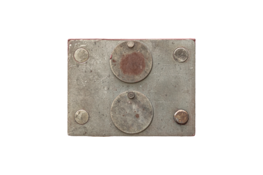 Old metal door lock with round keyhole covers is isolated
