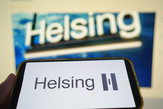Roosendaal, The Netherlands - July 27, 2025: A mobile phone displaying the logo of Helsing, a defense-focused AI company, with the website in the background.