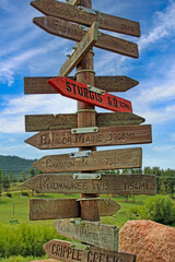 Signpost in central Colorado with distances to multiple cities
