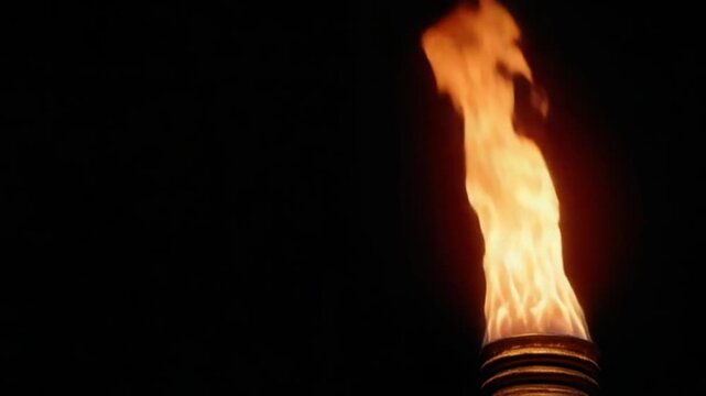 Burning torch against a dark background