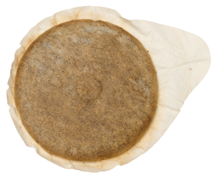 A round coffee pod or single serving of ground coffee wrapped in filter paper.