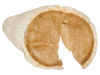 Torn round coffee capsule. Isolated background.