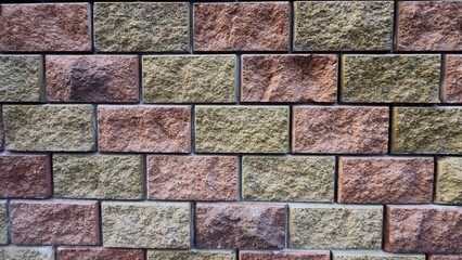 Stone wall made of rectangular blocks in natural tones — textured background for architectural and design projects
