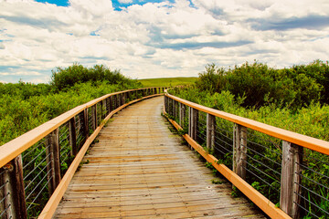 Fototapeta premium Crossing the Bridge over the Niobrara River on the Fossil Hills Trail, Agate Fossil Beds National Monument in Nebraska.