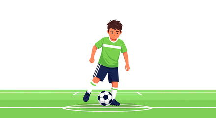 Obraz premium Boy Practices Soccer On The Field With Ball In Sports Uniform