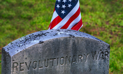 Grave marker honers a soldier who fought in the War of Independence. The  semiquincentennial commemoration of US Independence is in 2026.