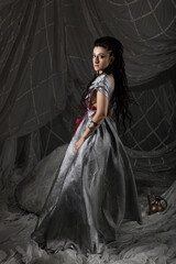 Beautiful woman in Arabic fairytale costume with oriental motifs, dressed for festive costume party